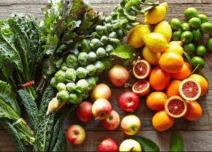 a group of fruits and vegetables on a wood surface Healthy Weight Loss Diets Isleworth